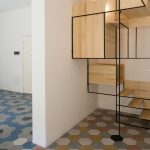 The Stylish Staircase Made of Metal Framework and Wooden Panels