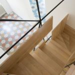 The Stylish Staircase Made of Metal Framework and Wooden Panels