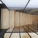 The Stylish Staircase Made of Metal Framework and Wooden Panels
