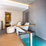 Architectureandinteriordesignofthethree storybuildinginmodernstylewithasaunaandapool