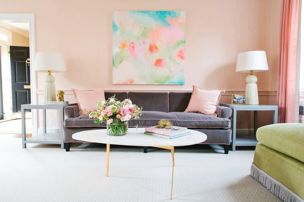 The rose and green colors in the living room interior